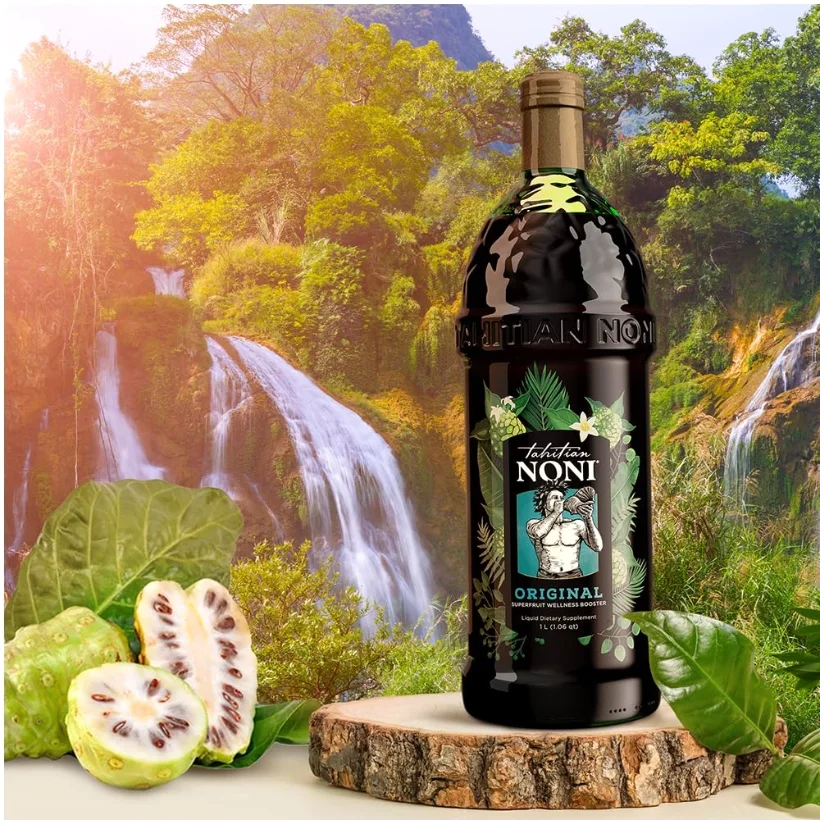 Cut noni beside the bottle. The flesh is pale and the seeds are dark and hard; the smell at this stage is the reason the juice is blended.